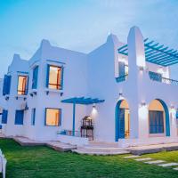 4 bedrooms villa with private pool in Tunis village faiuym, khách sạn ở Qaryat at Ta‘mīr as Siyāḩīyah