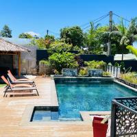 Charmant rez de jardin avec acces piscine, Hotel in Le Tampon