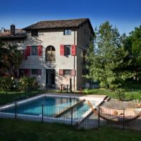 a swimming pool in front of a house at La Lepre Bianca, Cento