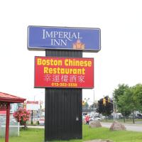 a sign for a boston chinese restaurant on a street at Imperial Inn 1000 Islands, Gananoque
