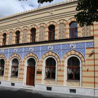 an old building with blue and yellow at İsa Begov Hamam Hotel, Sarajevo
