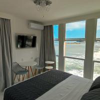 Grand Hotel Guarujá - A sua Melhor Experiência Beira Mar na Praia!，瓜魯雅Pitangueiras的飯店