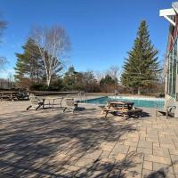 Relax & Rejuvenate at 2BR Retreat with Pool & Gym