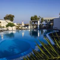 a large swimming pool with blue water at Sea View Beach Hotel - Adults Only - 14 Plus, Perivolos