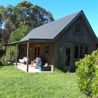 Woodland eco retreat, מלון בParapara 