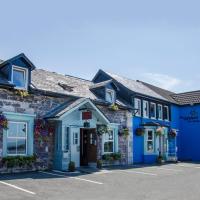 a row of blue buildings in a parking lot at Oyster Inn Connel, Oban
