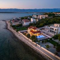Beach front villa with heated pool, jacuzzi, fantastic view, the sound of the waves - by Traveler tourist agency Krk ID 2404, hotel v destinaci Privlaka