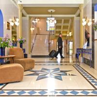 a man walking through the lobby of a hotel at BEST BALTIC Hotel Druskininkai Central