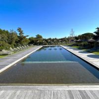 Residence Cala Sultana -Baie Santa Giulia - rez jardin 1ere ligne, hotel en Porto Vecchio