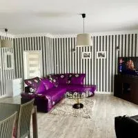 LAS SŁUPSKI PREMIUM PANORAMIC APARTAMENT A8 -- Salon balkon widok fotel masaż - - Smart TV55 Wifi Netflix pełna kuchnia -- sypialnia -- salon kąpielowy z TV i dwuosobowa wanna -- wysoka jakość za niską cenę -- zapraszamy, отель в Слупске