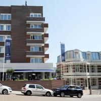 a group of cars parked in front of a building at Hotel Andante aan Zee, Scheveningen