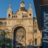 a large building with an arch in front of it at De Keyser Hotel, Antwerp