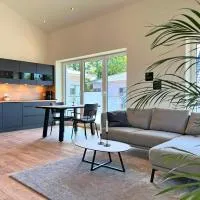 Haus Kiebitz 2 OG - Neubau-Apartment mit Infrarot-Sauna, Balkon & 600 m zum Strand,瓦雷爾的飯店