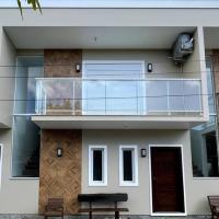 Casa Beira-Mar na Praia da Ferrugem Unidade Azure, hotell i Garopaba