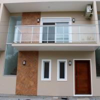 Casa Beira-Mar na Praia da Ferrugem Unidade Lumina, hotell i Garopaba