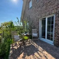 Ferienwohnung Capitano: Eckwarden şehrinde bir otel
