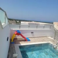Appartement avec piscine vue sur mer, hotell sihtkohas Raʼs al Jabal