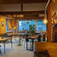 コワーキングスペース kuzume Base ゲストハウス TOMARUKU, hotel em Konan