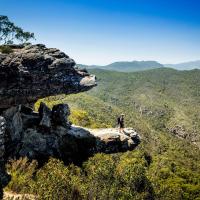a man standing on top of a rocky mountain at NRMA Halls Gap Holiday Park