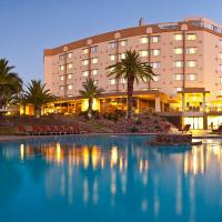 a large swimming pool in front of a hotel at Safari Court Hotel Managed By Accor, Windhoek