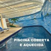 Hotel Costa Balena, Conforto e Piscina aquecida e coberta a 100m da Praia da Enseada, ξενοδοχείο σε Γκουαρούχα