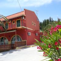 a red building with flowers in front of it at Skyline, Velonádes