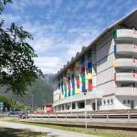 a building with colorful balconies on the side of it at Hotel Liberty Self Check-In, Bellinzona