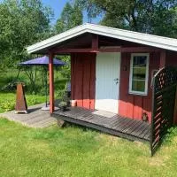 Riverside Bliss - Cozy Cabin near Tvedestrand with WiFi and Deck、Vegårsheiのホテル