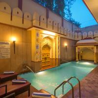 a large swimming pool in a building at Umaid Mahal - A Heritage Style Boutique Hotel, Jaipur