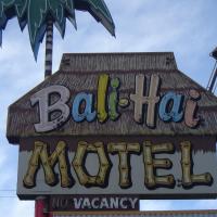 a sign for a restaurant with a no vacancy sign at Bali Hai Motel, Yakima