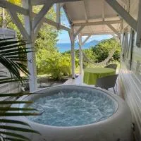 Bungalow vue sur mer avec jacuzzi en pleine nature、ル・ロベールのホテル