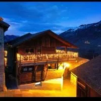 Grand appartement avec terrasse à Chez-Les-Reuses, hotell i Orsières