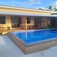 Villa Santai Mentawai, מלון בTua Pejat