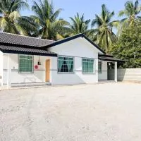 Rumah Huda, готель у місті Букіт-Мертаджам