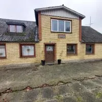 Døssinghus Holiday Apartments, хотел в Kjellerup
