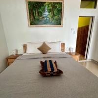 Dewata Beach House, хотел в Амед