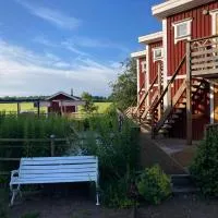 Madam Blås mysiga stugor med vedeldad bastu och badtunna, hotel Nossebro városában
