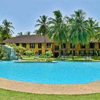 a large swimming pool in front of a resort at Pestana Miramar São Tomé