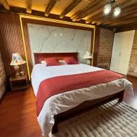 Cabaña familiar en el Campo Malchinguí cerca de Aquapark, hotel em Malchinguí