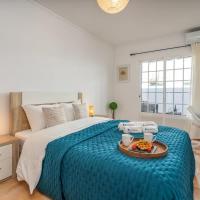 Bright & Cozy House with Terrace by HostWise، فندق في Caba&ccedil;os