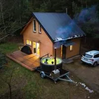 Domek w lesie nad stawem Sauna Balia Podlasie – hotel w Zabłudowie