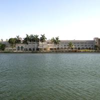 a large building in front of a large body of water at Hotel Lakend, Udaipur