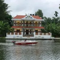 Mango Kerala Homes, отель в городе Кумараком