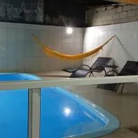 Casa com piscina Itanhaem, отель в городе Suarão