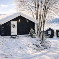 Sjarmerende tømmerhytte på gårdstun, hotel em Baukål