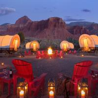 a group of red chairs and a fire in the desert at Capitol Reef Resort, Torrey