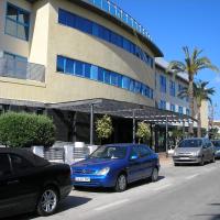 a group of cars parked in front of a building at Hotel Rober Palas, Albir