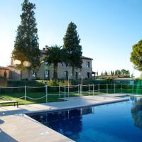 a swimming pool with a fence and a house at Hotel Villa Monter, Alcañiz