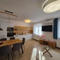Harmónia Apartmanház, отель в Кёсеге