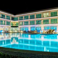 a large pool in front of a building at night at Howard Johnson Neuquen, Neuquén